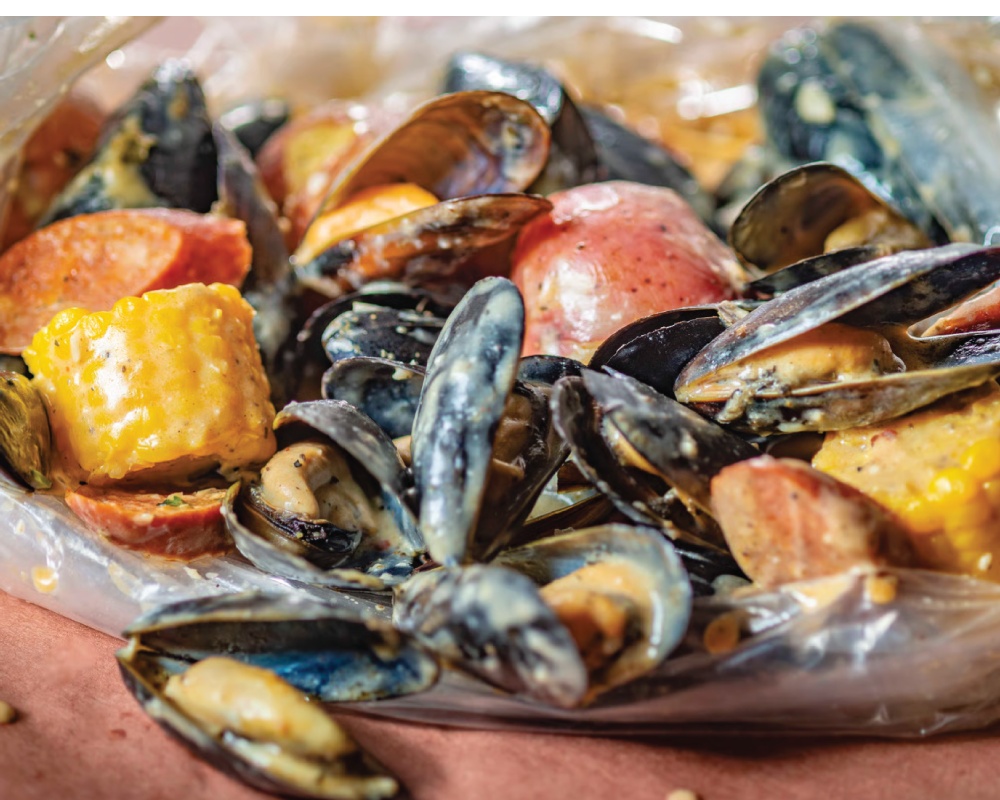 Mussels in a seafood boil with corn and potatoes